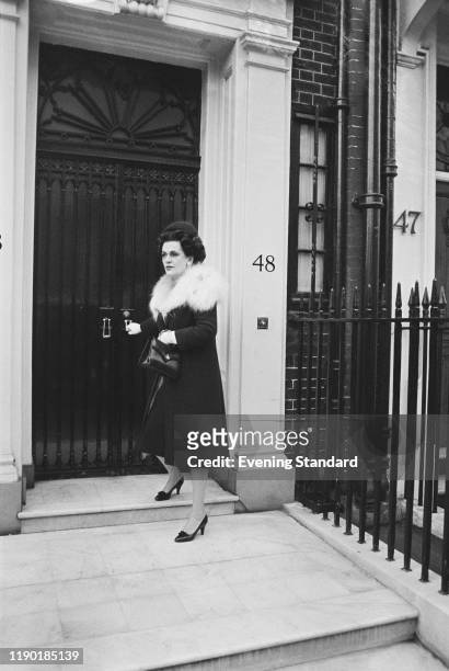 Margaret Campbell, Duchess of Argyll , former third wife of Ian Campbell, 11th Duke of Argyll, closes the front door of her house at 48 Upper...