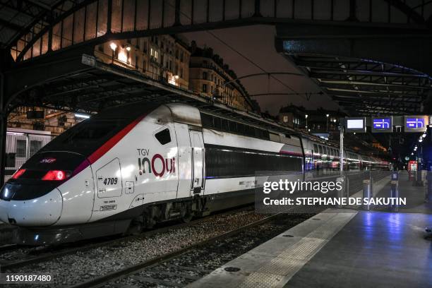 Train of the French state railway company SNCF arrives at the Gare de l'Est train station in Paris on December 23 on the 19th day of a nationwide...