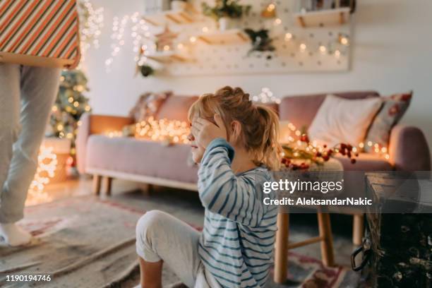 waiting for my christmas present - hands covering eyes stock pictures, royalty-free photos & images