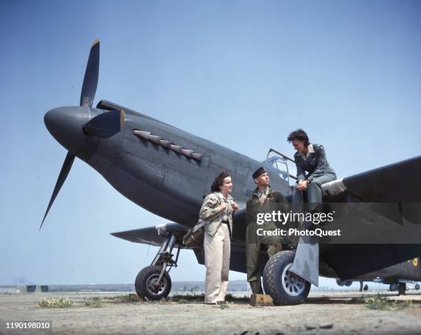 Army promotional photo features Barbara Jane Erickson and Evelyn Sharp , both Women's Auxiliary Ferrying Squadron pilots, along with an unidentified...