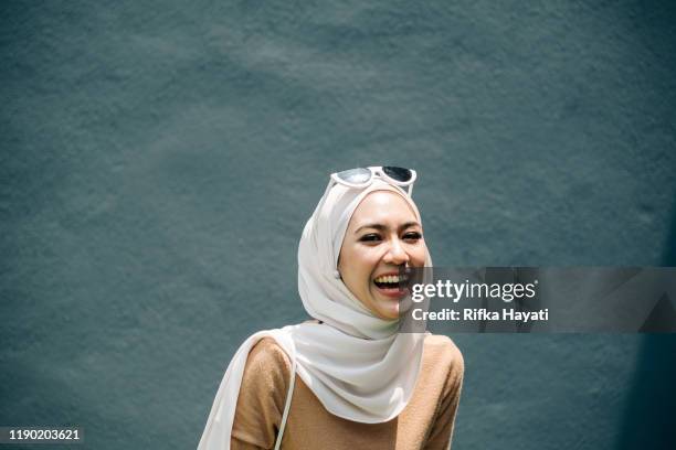 portrait of young women with happy expression - hijab stock pictures, royalty-free photos & images