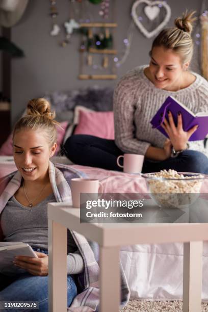 Two Students Comparing Notes Couple Comparing Notes Photos and Premium High Res Pictures - Getty Images