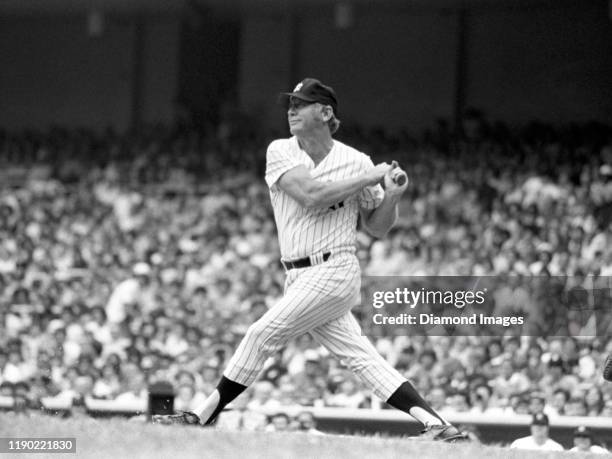 Former outfielder Mickey Mantle of the New York Yankees at bat during the Old Timer's Day game prior to a regular season game on August 12, 1977...