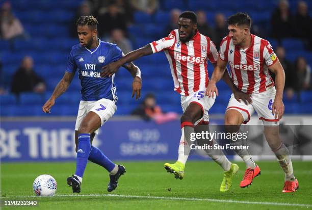 Cardiff player Leandro Bacuna beats Stoke defenders Bruno Martins Indi and Danny Batth to score the opening goal during the Sky Bet Championship...