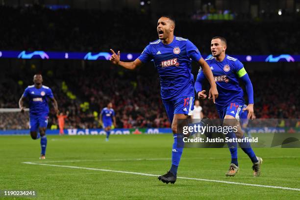 Youssef El Arabi of Olympiacos celebrates after scoring his team's first goal during the UEFA Champions League group B match between Tottenham...