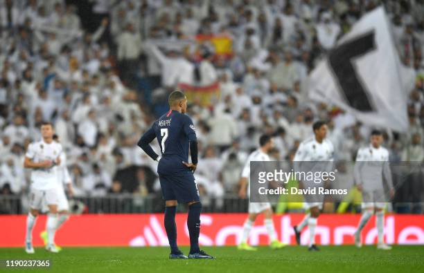 Kylian Mbappe of Paris Saint-Germain looks dejected after Karim Benzema of Real Madrid scores his team's first goal during the UEFA Champions League...