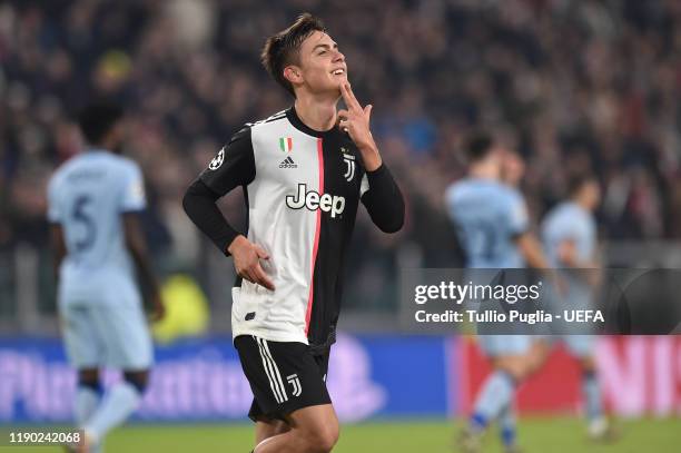 Paulo Dybala of Juventus celebrates after scoring the opening goal during the UEFA Champions League group D match between Juventus and Atletico...
