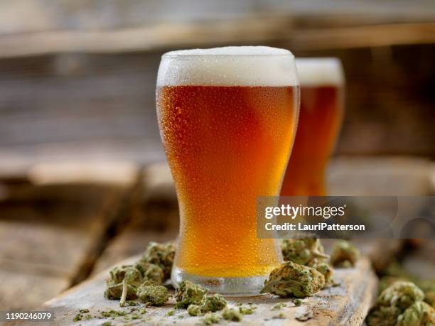 cannabis infused amber ale - ale stock pictures, royalty-free photos & images