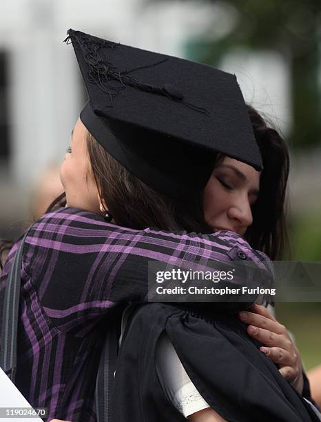 Students at the University of Birmingham congratulate one another as they take part in their degree congregations as they graduate on July 14, 2011...