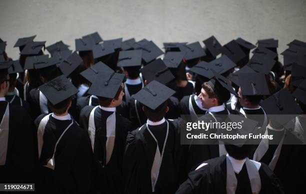 Students pose for their official group photograph at the University of Birmingham as they take part in their degree congregations on July 14, 2011 in...