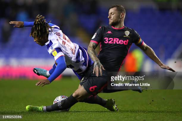 Danny Loader of Reading FC is tackled by Liam Cooper, Captain of Leeds United during the Sky Bet Championship match between Reading and Leeds United...