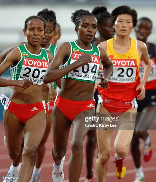 Tirunesh Dibaba of Ethiopia leads teammate Meseret Defar in the women's 5,000 meters in the IAAF World Championships in Athletics at Olympic Stadium...