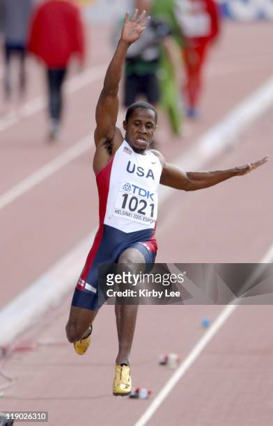 Dwight Phillips of the United States had the top qualifying mark in the long jump preliminaries with a wind-aided 28-2 1/4 in the IAAF World...