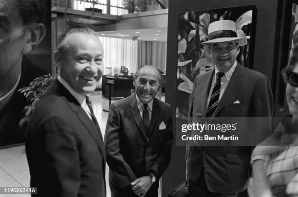 Alfred Eisenstaedt , renowned German born American staff photographer for Life magazine at his Witness to our time exhibit with colleagues, August...