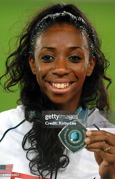 Lashinda Demus of the United States poses with bronze medal during the womens' 400-meter hurdle medal ceremony at the IAAF World Championships in...