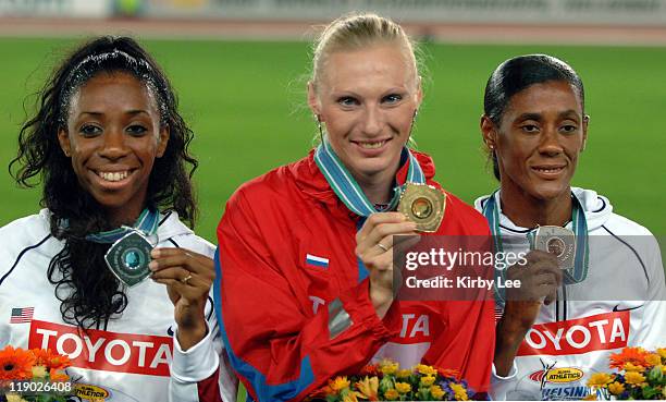 Bronze medallist Lashinda Demus of the United States, gold medallist Yuliya Penchonkina of Russia and Sandra Glover of the United States pose with...