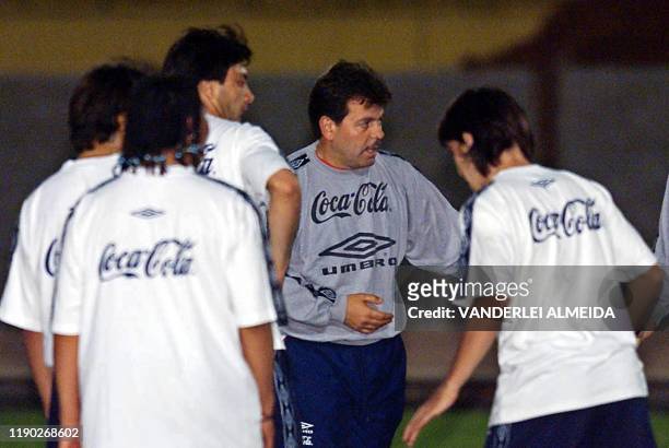 George Garcez , coach of the chilean soccer team, instructs players, 05 October 2001, during a practice in Curitiba, south Brazil. Jorge Garcez ,...