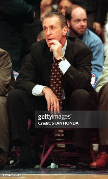 Miami Heat coach Pat Riley, who usually stands throughout the game, sits on the bench as he watches his team lose to the New York Knicks during the...
