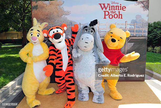 Rabbit, Tigger, Eeyore and Winnie the Pooh pose at Walt Disney Pictures presents the premiere of "Winnie The Pooh" at Walt Disney Studios on July 10,...