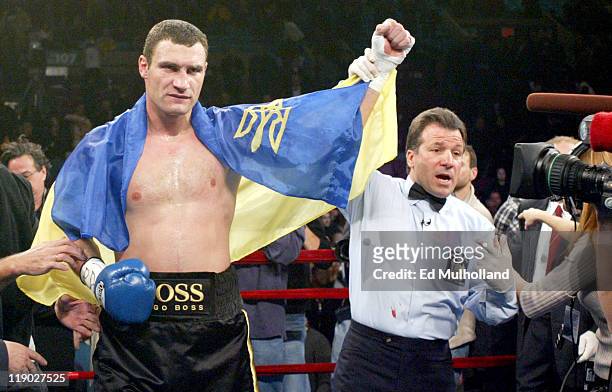 Referee Arthur Mercante Jr. Raises the arm of Vitali Klitschko after his 2nd round knockout win of Kirk Johnson Saturday night at Madison Square...