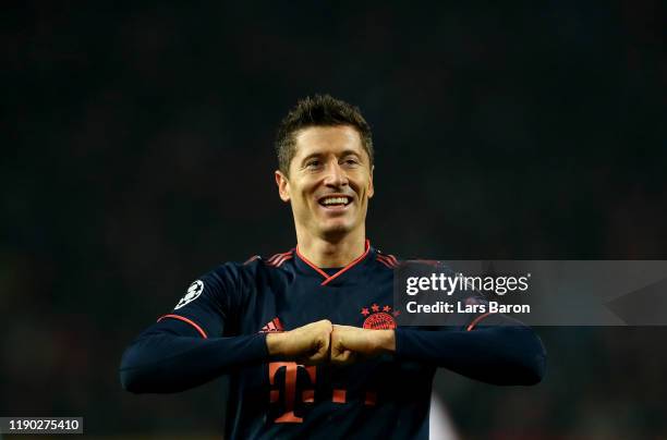 Robert Lewandowski of Bayern Muenchen celebrates after scoring his third and his teams fourth goal during the UEFA Champions League group B match...