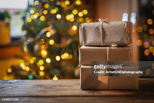 christmas presents on wooden table. - green christmas background stock pictures, royalty-free photos & images