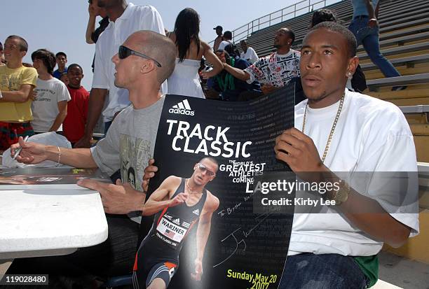 Long Beach Poly High senior Bryshon Nellum poses with poster autographed by 2004 Olympic 400-meter gold medallist Jeremy Wariner in Long Beach,...