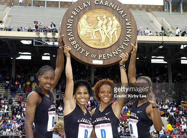 The South Carolina women's 4 x 100-meter relay Shalonda Solomon, Amberly Nesbitt, Alexis Joyce and Erica Whipple hold championship plaque after...