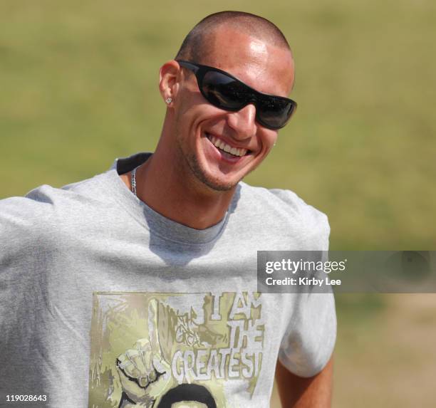Jeremy Wariner, the 2004 Olympic gold medallist in the 400 meters, visits with the track team at Long Beach Poly High School in Long Beach, Calif. On...