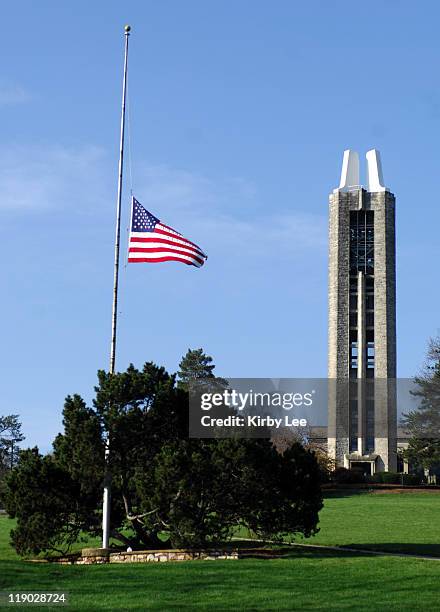 The United States flag flies a half mast in memory of Virginia Tech shooting victims at the University of Kansas World War II Memorial Campanile and...