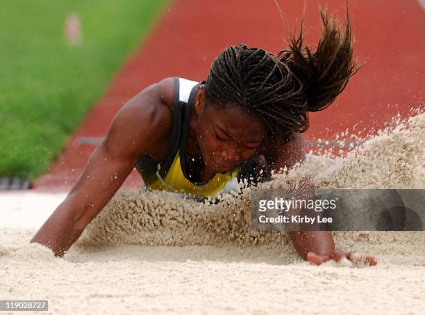 Tianna Madison lands in the sand pit in the women's long jump at the Road To Eugene '08 track & field meet at the University of Oregon's Hayward...