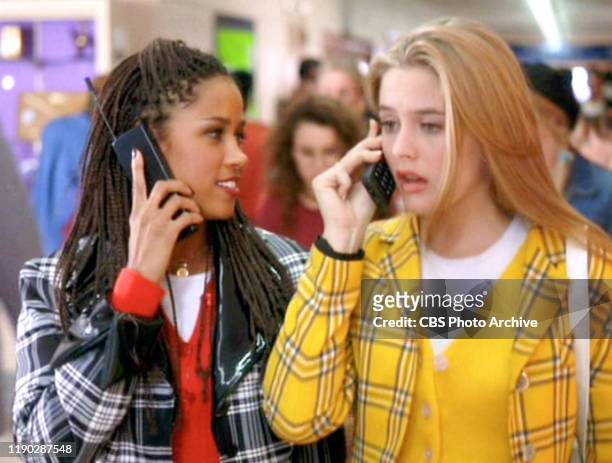 The movie "Clueless", written and directed by Amy Heckerling. Seen here from left, Stacey Dash , and Alicia Silverstone . Theyre using cell phones....