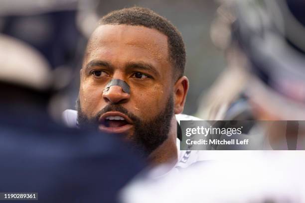 Duane Brown of the Seattle Seahawks looks on from the bench against the Philadelphia Eagles at Lincoln Financial Field on November 24, 2019 in...