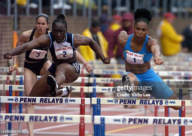 Anjanette Kirkland outduels Michelle Freeman to win the women's Olympic Development 100-meter hurdles, 12.95 to 13.08, in the111th Penn Relays at the...