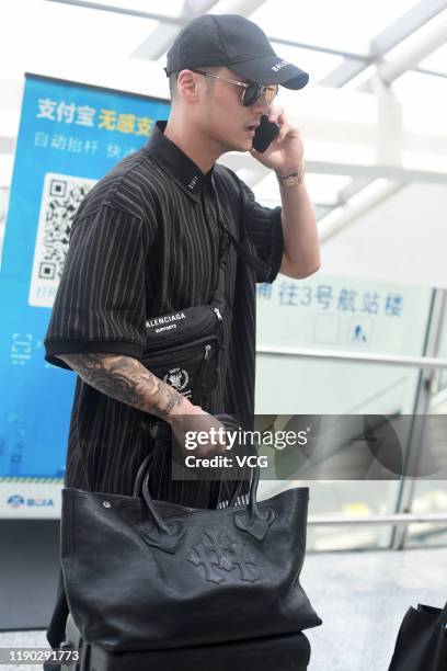 Actor Jiang Jinfu is seen at airport on May 23, 2019 in Shanghai, China.