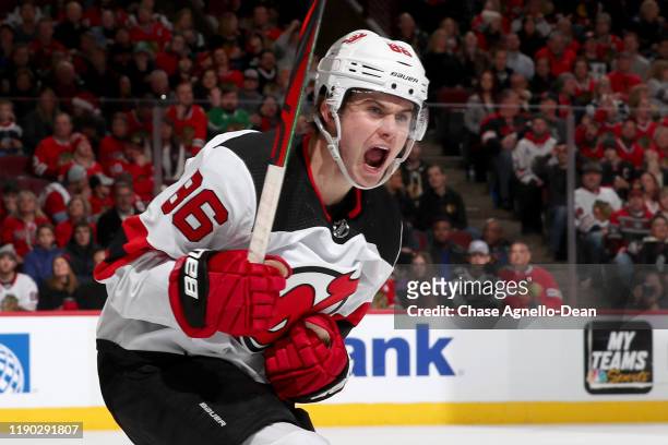 Jack Hughes of the New Jersey Devils reacts after scoring against the Chicago Blackhawks in the first period at the United Center on December 23,...