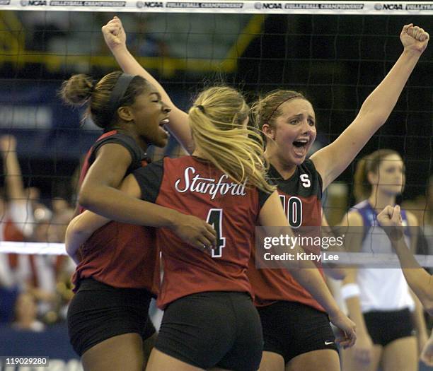 Ogonna Nnamani, Bryn Kehoe and Kristin Richards of Stanford celebrate during 30-25, 23-30, 30-37, 30-24 victory over Washington in NCAA women's...