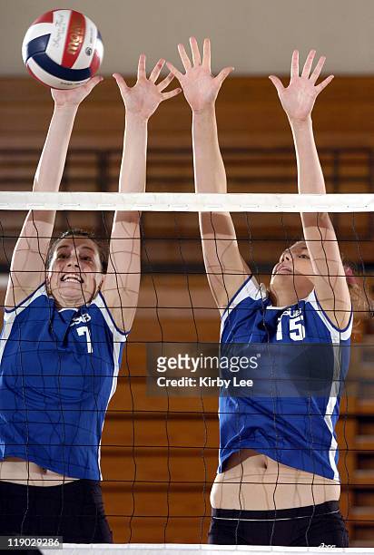 Lindsey Jordan and Melissa Myers of Cal State Bakersfield team for a block in 30-24, 21-30, 17-30, 30-27, 15-9 victory over Cal State Dominguez Hills...