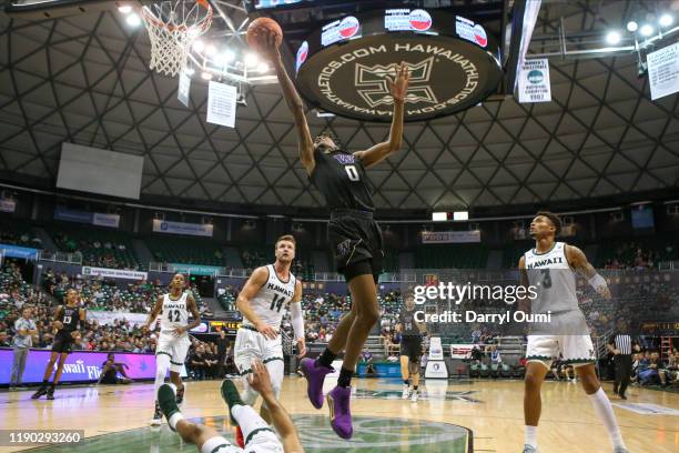 Jaden McDaniels of the Washington Huskies lays the ball in during the first half of the game at the Stan Sheriff Center on December 23, 2019 in...