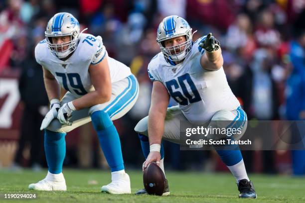 Graham Glasgow and Kenny Wiggins of the Detroit Lions line up against the Washington Redskins during the second half at FedExField on November 24,...