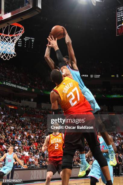 Derrick Jones Jr. #5 of the Miami Heat dunks on Rudy Gobert of the Utah Jazz on December 23, 2019 at American Airlines Arena in Miami, Florida. NOTE...