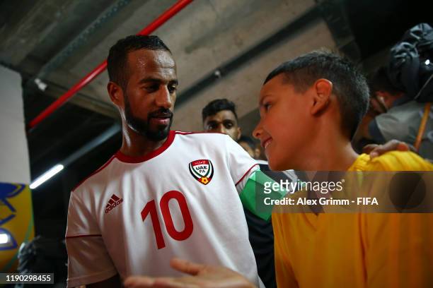 Walid Mohammad of United Arab Emirates UAE talks to the player escort kid in the tunnel prior to the FIFA Beach Soccer World Cup Paraguay 2019 group...