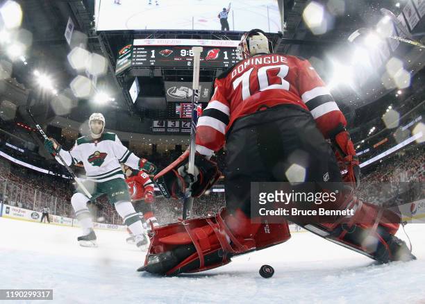 Shot by Jordan Greenway of the Minnesota Wild eludes Louis Domingue of the New Jersey Devils at 10:07 of the second period at the Prudential Center...