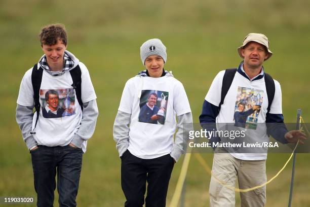 Golf fans wear T- shirts paying tribute to the late Seve Ballesteros during the first round of The 140th Open Championship at Royal St George's on...