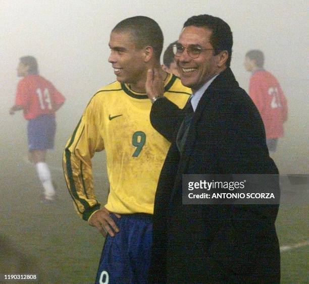 Brazilian Technical Director Wanderley Luxemburgo greets Ronaldo after referee Horacio Elizondo decided to halt their Copa America group B match with...