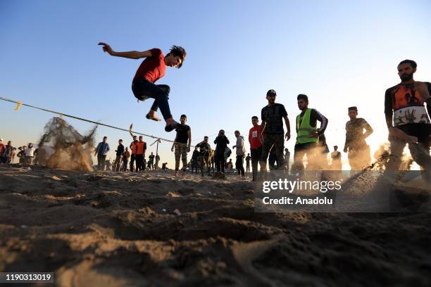 Iraqi youth enjoy at Tahrir beach in Baghdad, Iraq on December 23, 2109. Young protesters in Baghdad, continue to protest the government and also...