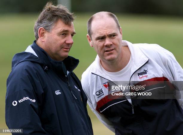 Australian Wallabies head coach Rod Macqueen receives some words of advice from Rodney Eade , the coach of the Sydney Swans Australian Rules football...
