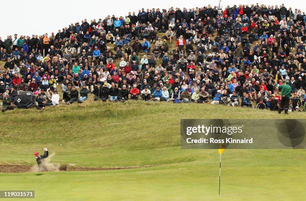 Justin Rose of England hits his 2nd shot on the 6th hole during the first round of The 140th Open Championship at Royal St George's on July 14, 2011...