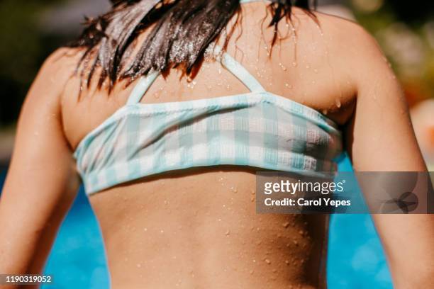 medium shot  wet girl after pool afternoon - swimwear ストックフォトと画像