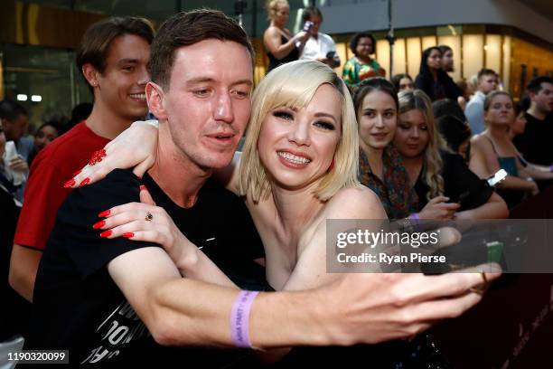 Carly Rae Jepsen poses with a fan on the red carpet ahead of the 33rd Annual ARIA Awards 2019 at The Star on November 27, 2019 in Sydney, Australia.